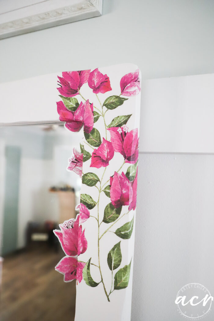 up close of pink floral transfer on white mirror