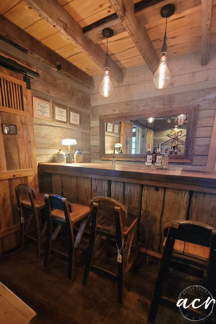 bar with chairs and wood walls in tasting room