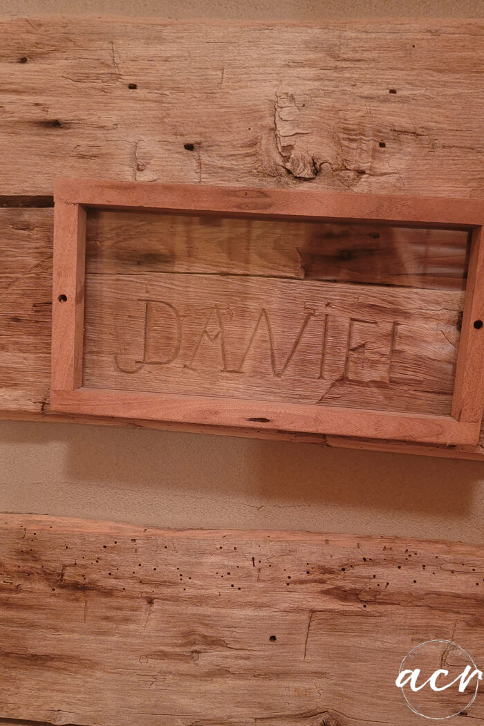 daniel carved into wood with frame