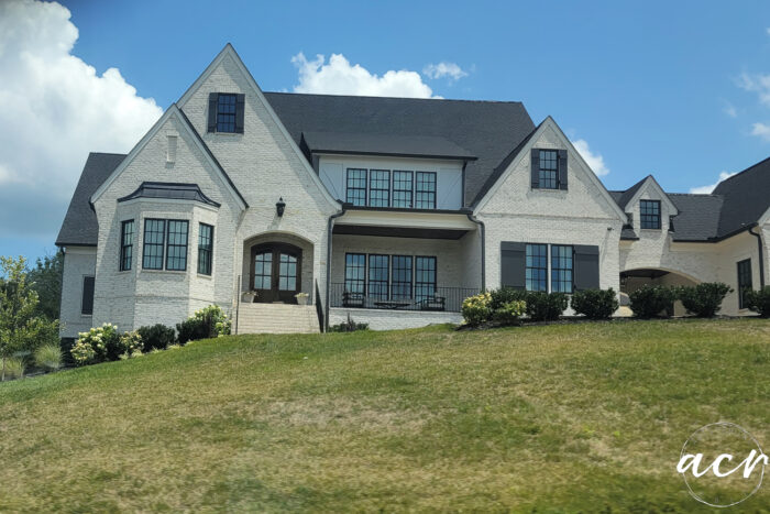 large painted brick house with black trim