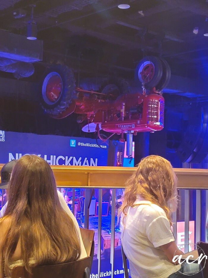 red tractor upside down on ceiling