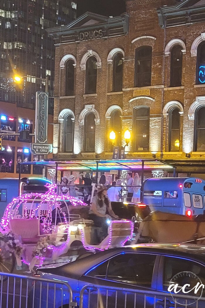horse carriage and blue party school bus