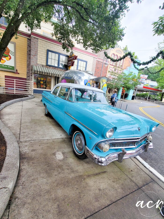 blue car in faux small town