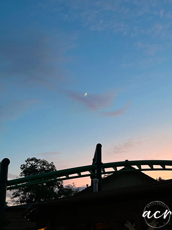 blue and pink sky with half moon