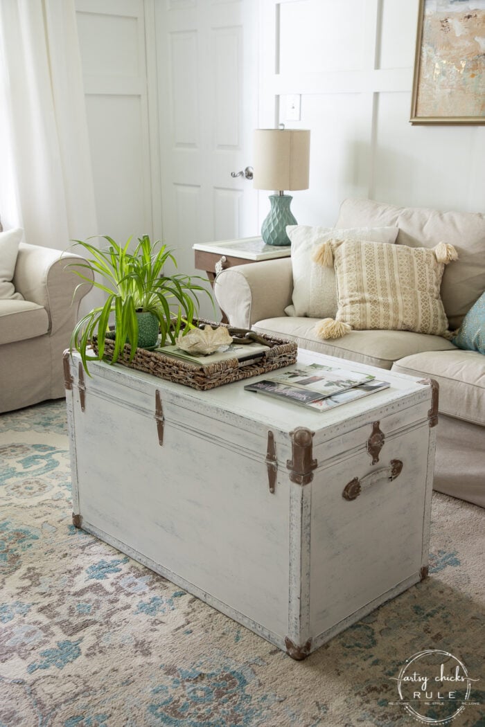 white painted trunk with brass colored trim