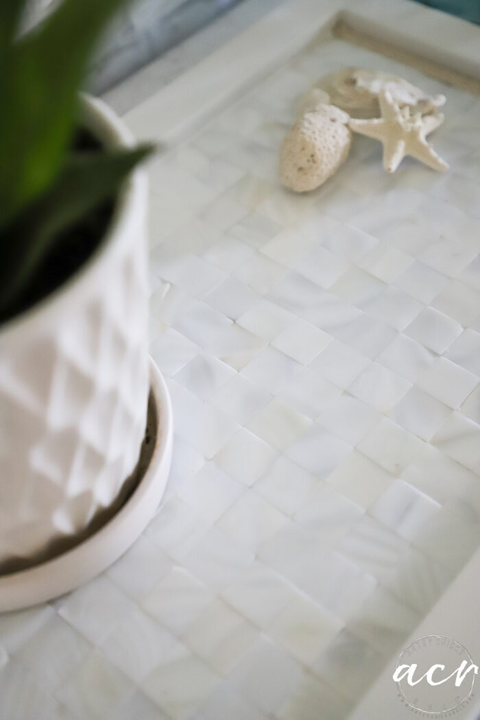 close up of white tiled tray