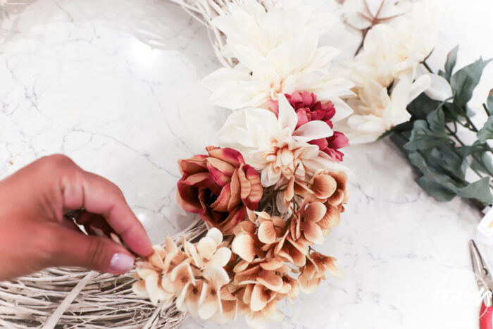 rust colored swag on wreath with florals