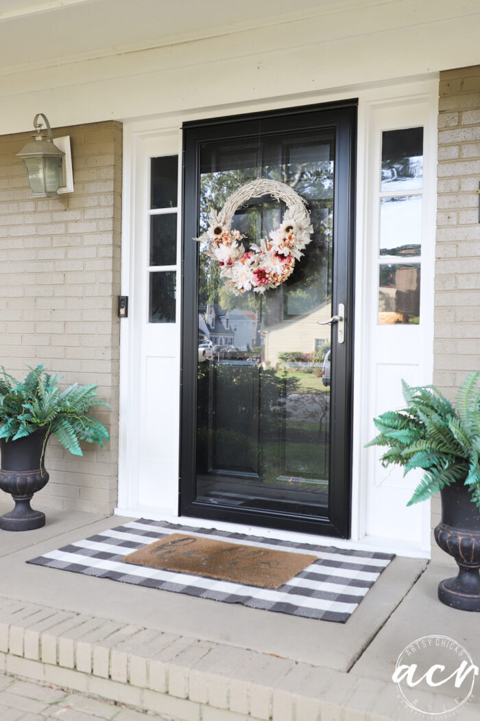 black door with autumn wreath