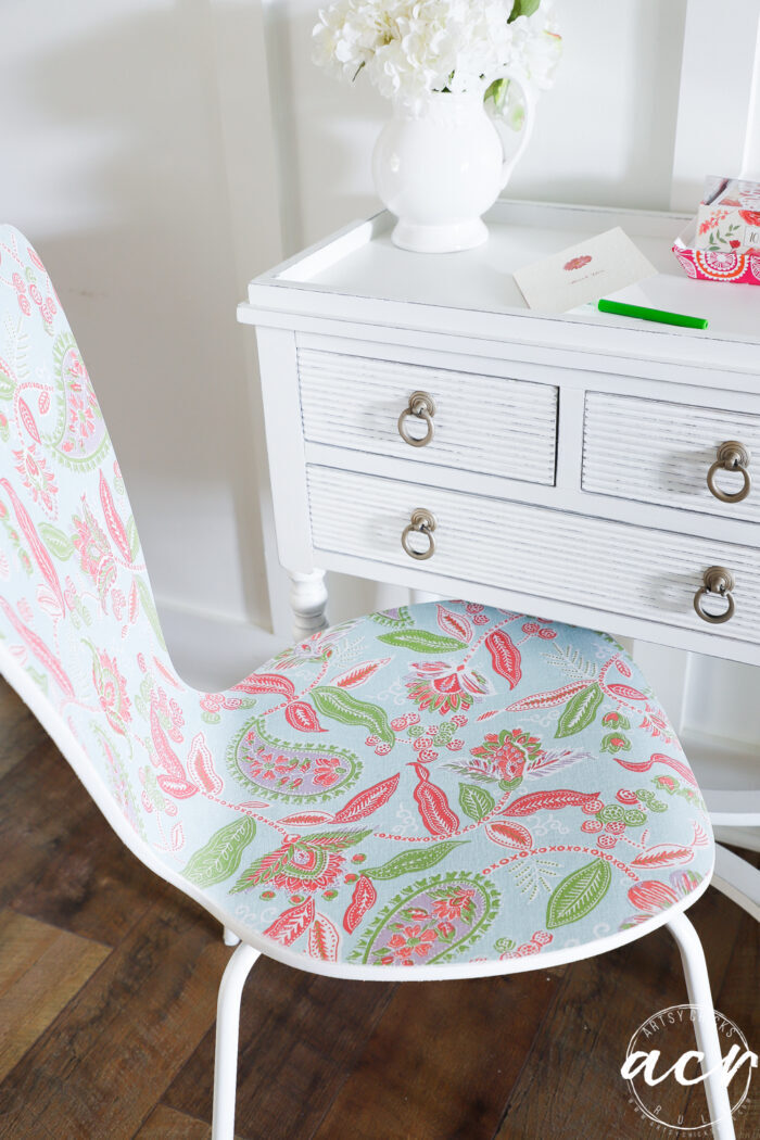 pink and green chair with white desk