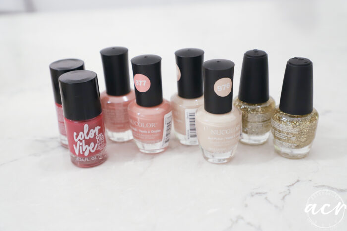 nail polish bottles on white countertop