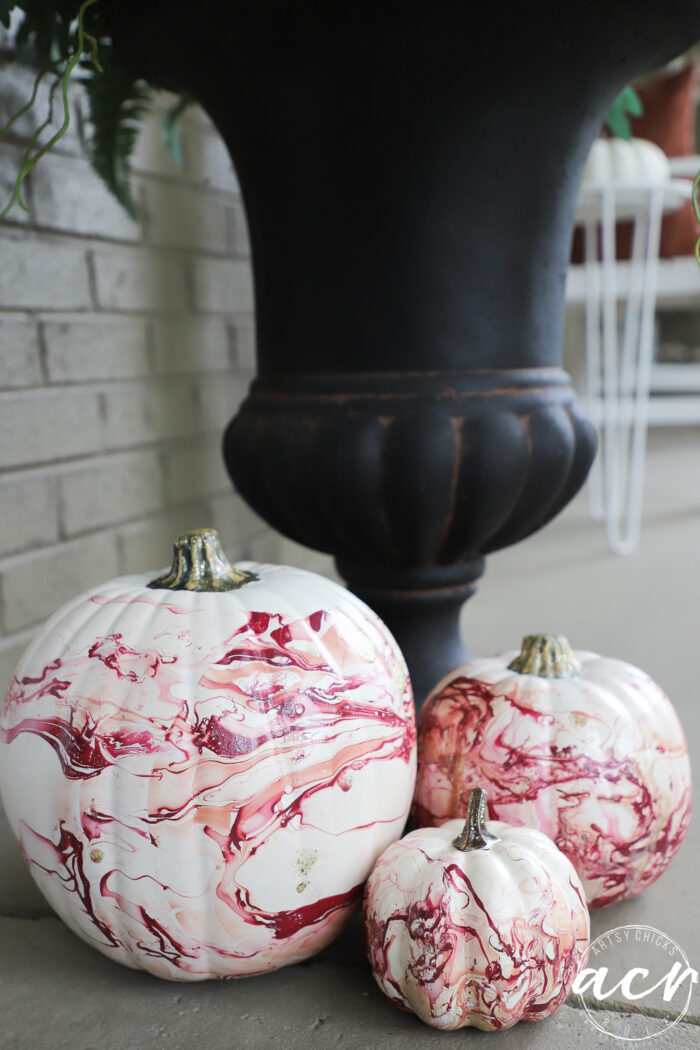 3 marbled pumpkins on porch