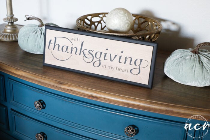 thanksgiving sign on blue dresser with aqua fabric pumpkins on each side
