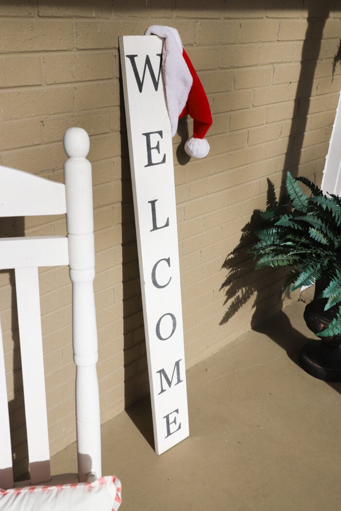 tall welcome sign with santa hat