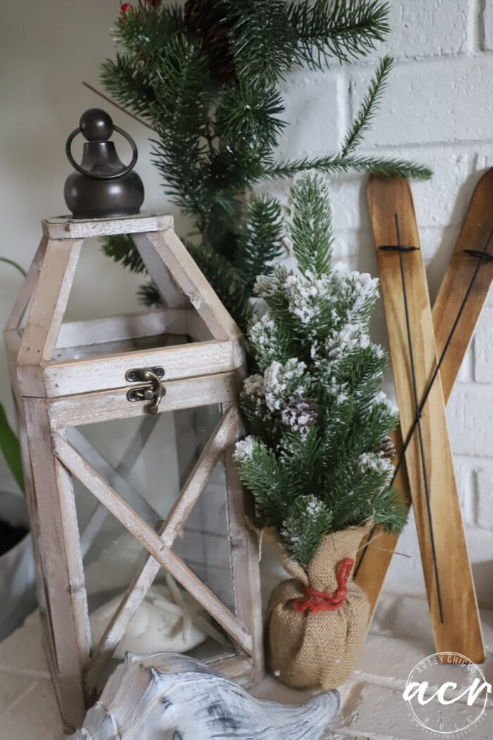 green christmas tree with tiny wood skis