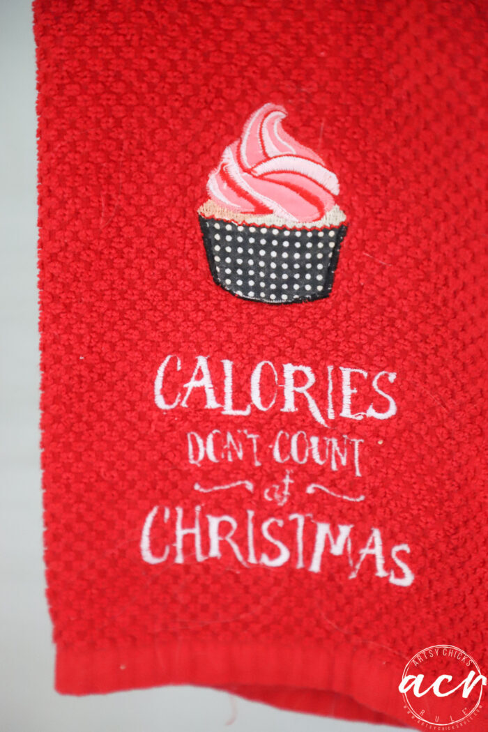 red kitchen towel that says calories don't count at christmas