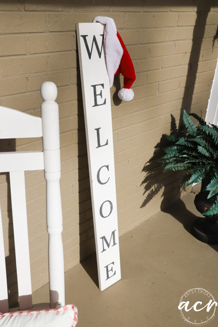 tall welcome sign with santa hat