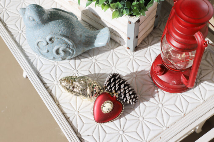 white tiled table with red lantern and ornaments