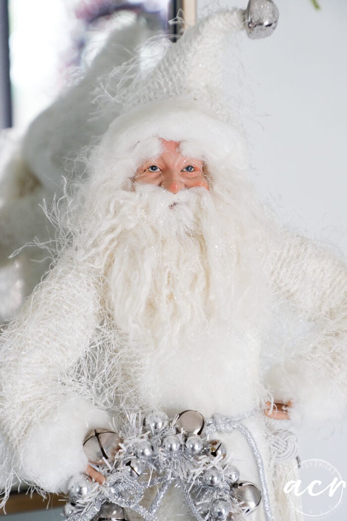 santa figurine with white clothes and cute face