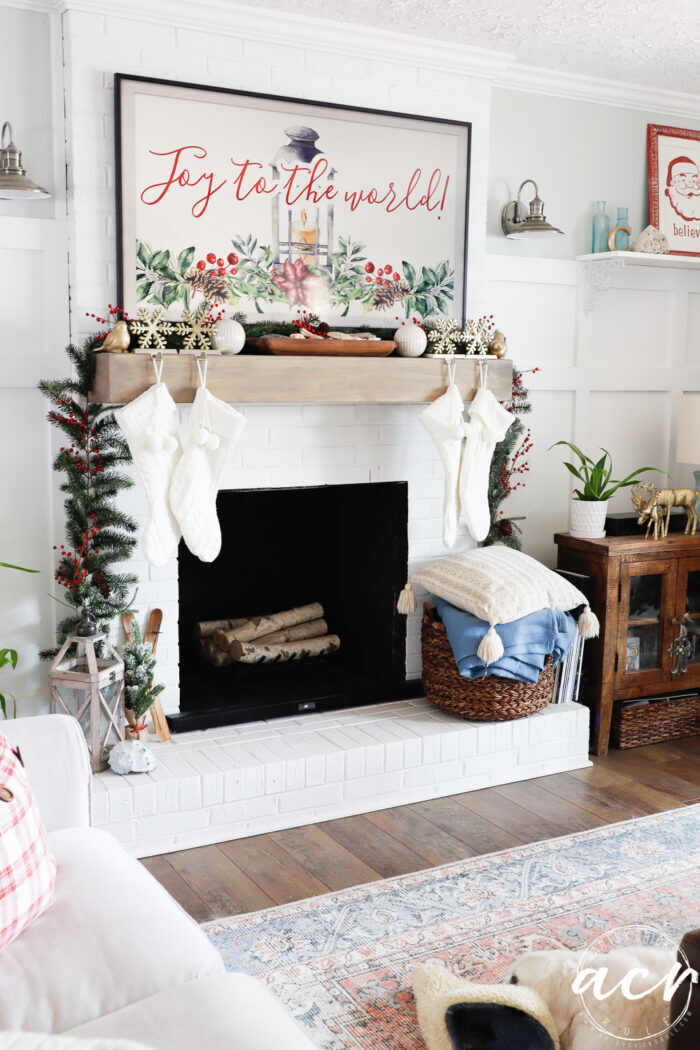 living room with fireplace and white dog