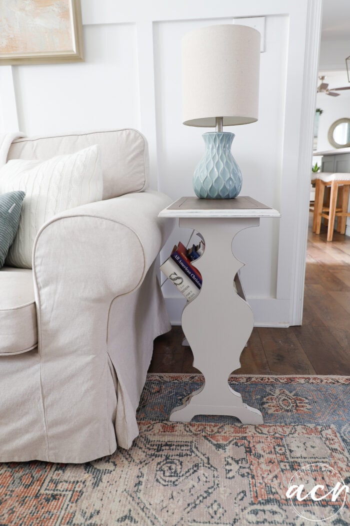 side view of side book table in beige color