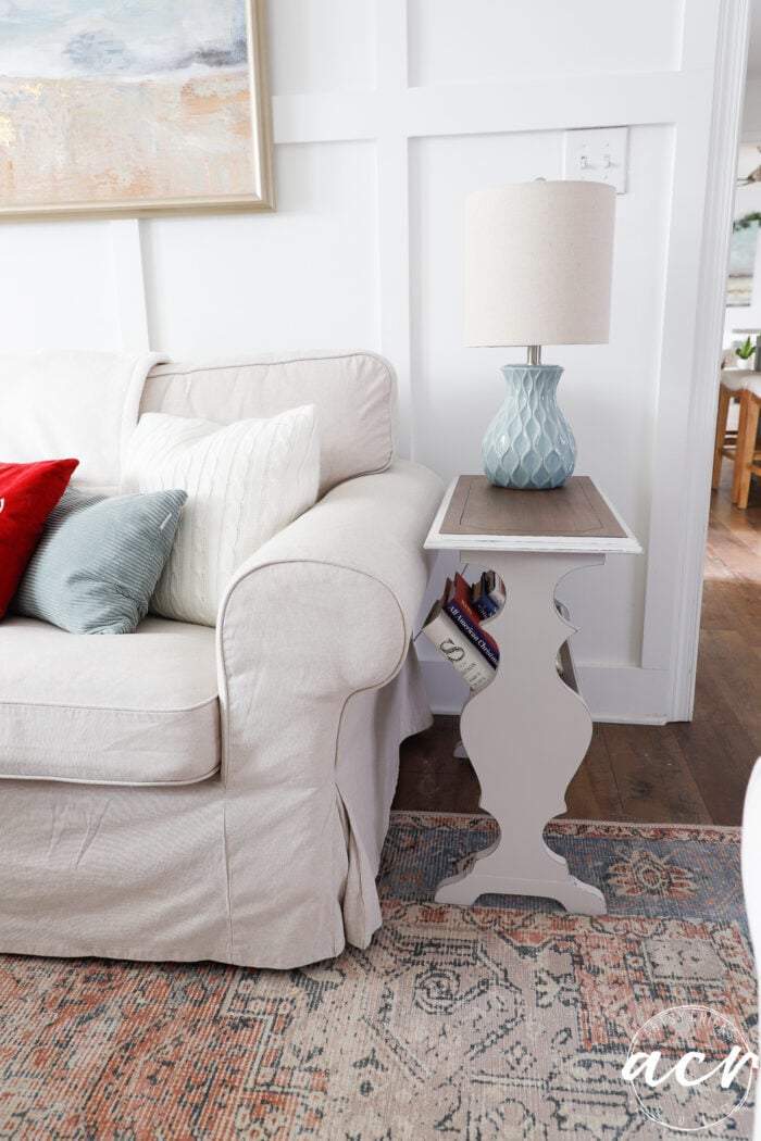 beige side book table beside couch