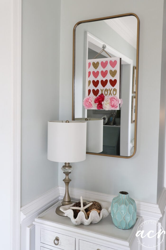 valentine's hanger on glass mirror in foyer