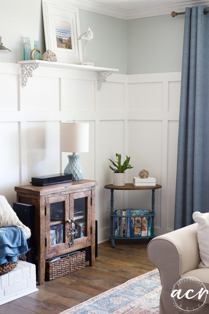 board and batten walls with blue table stained top in corner 