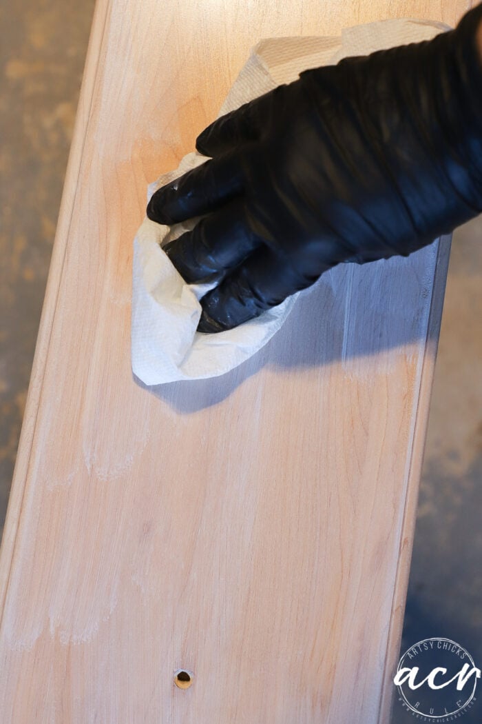 applying white stain to drawer fronts