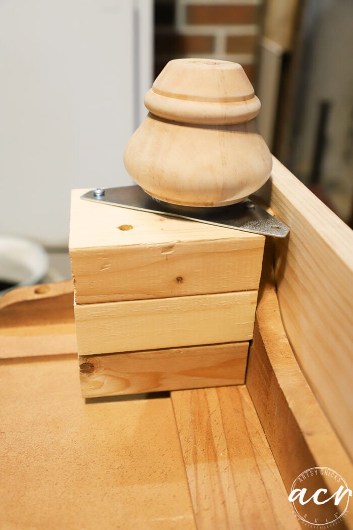 attaching the feet with blocks under dresser