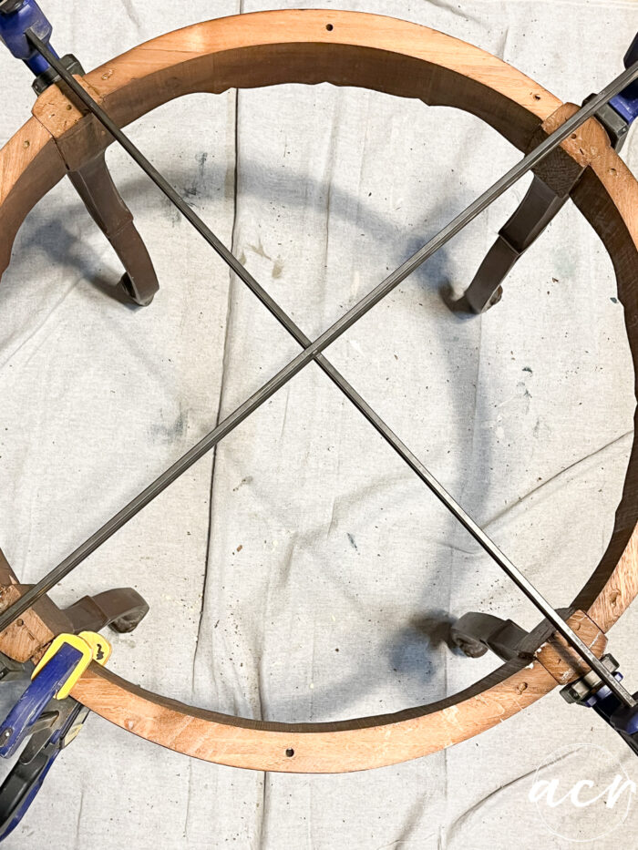 table with top removed and clamps attached