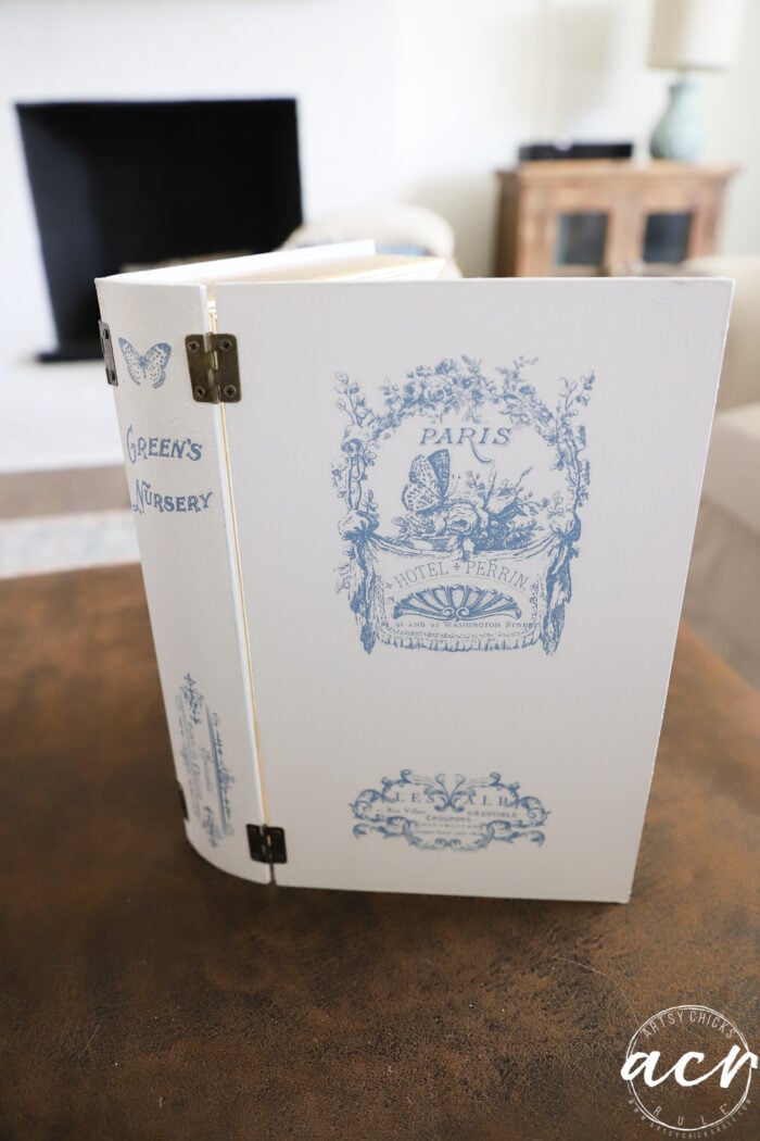 blue and white book with transfers