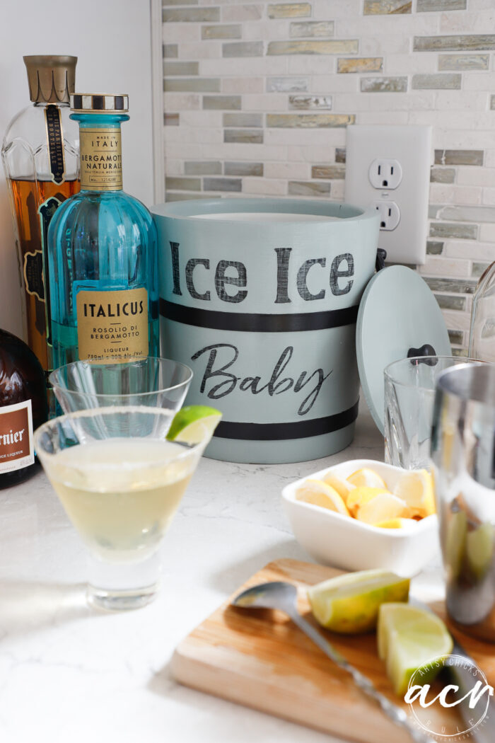 ice bucket on counter with cocktails and more