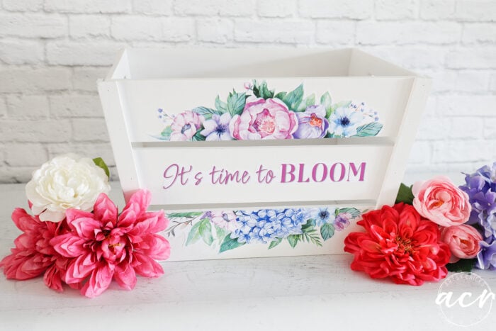 white wood slat crate with colorful flowers