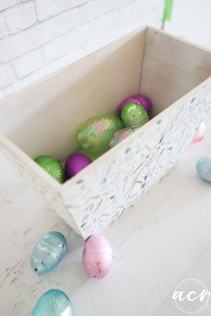 wood box with plastic eggs
