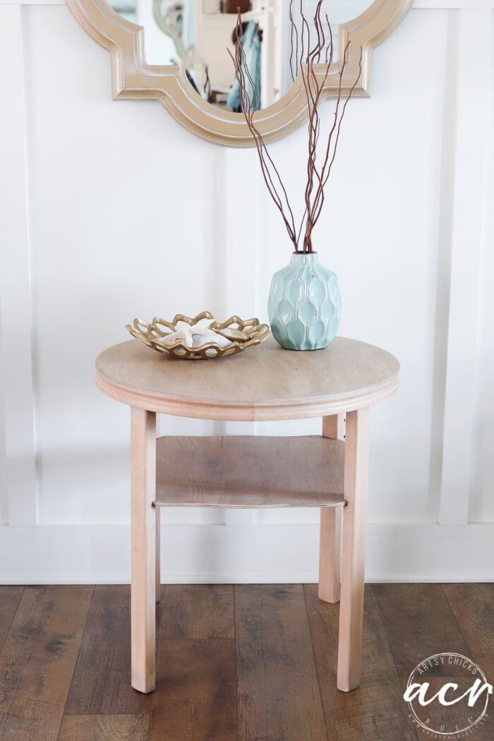 finished table styled with aqua vase and gold bowl