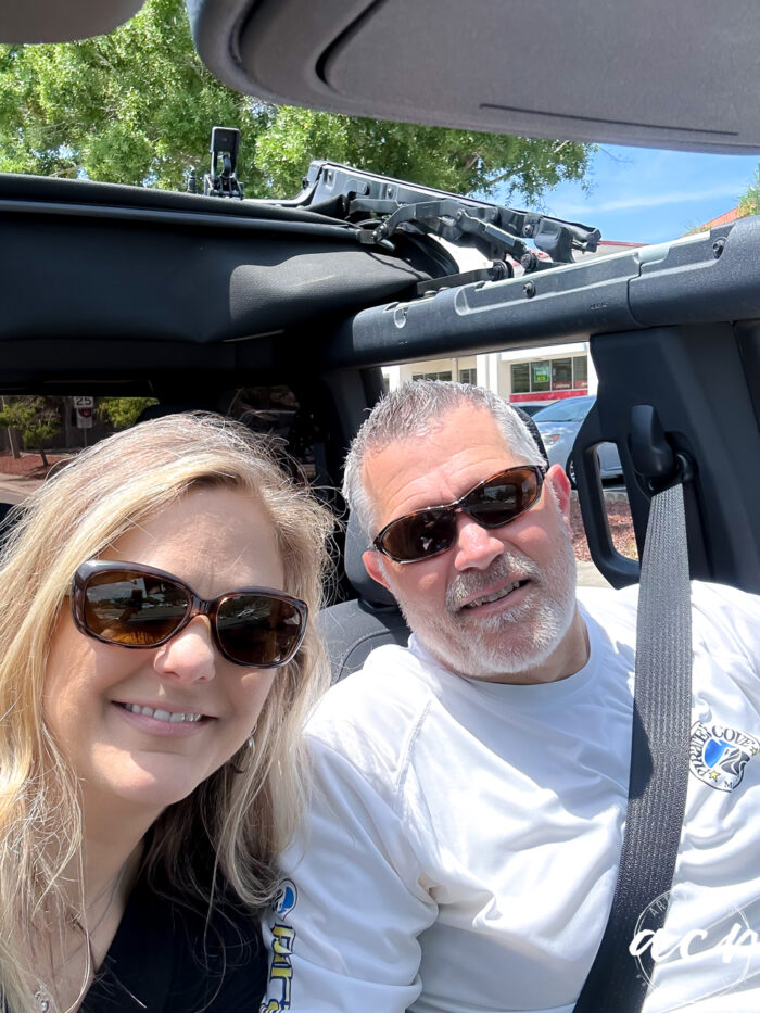 Man and woman in open Bronco