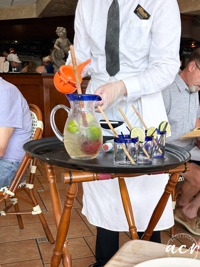 making mojitos on tray right by table