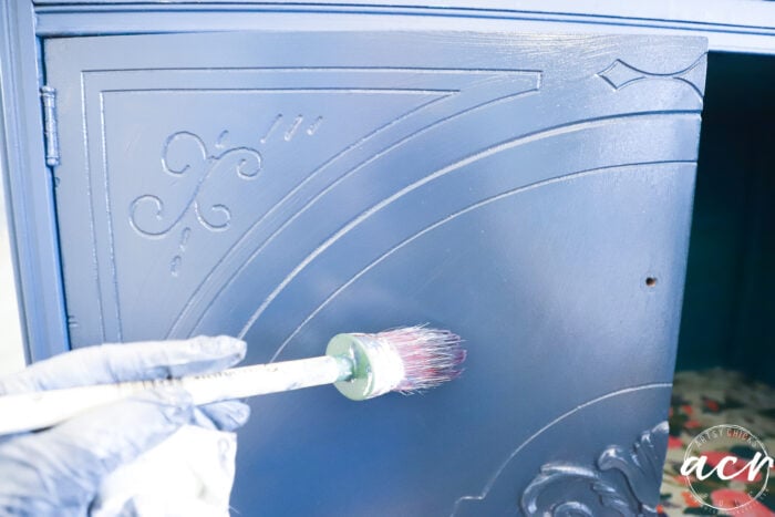 applying the glaze to the door with brush