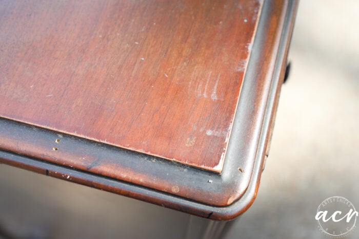 holes in top edge of cabinet
