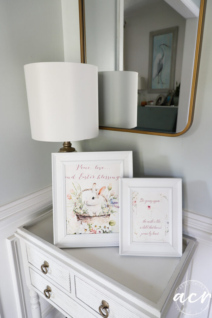 printables printed on canvas in white frames on white foyer table