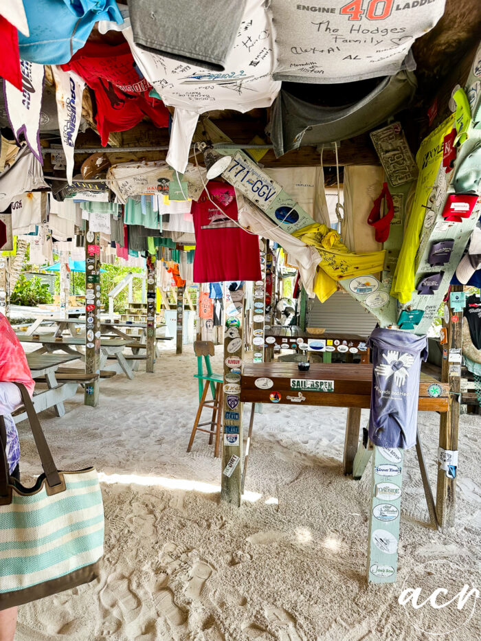 tshirts hanging from ceiling in outdoor bar