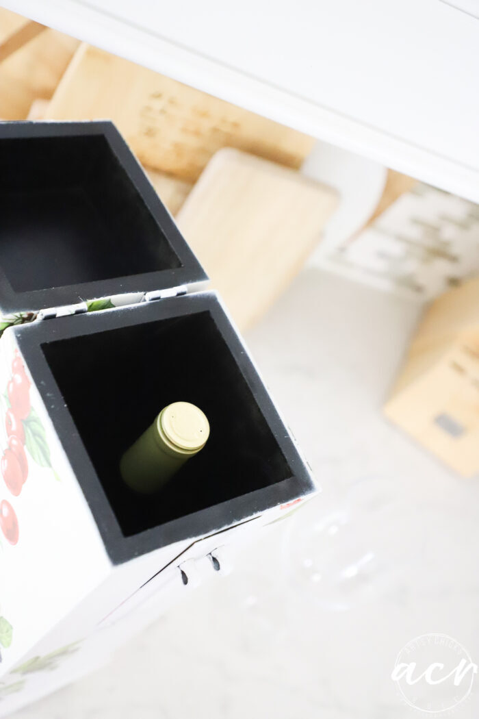 inside of wine box with wine bottle inside