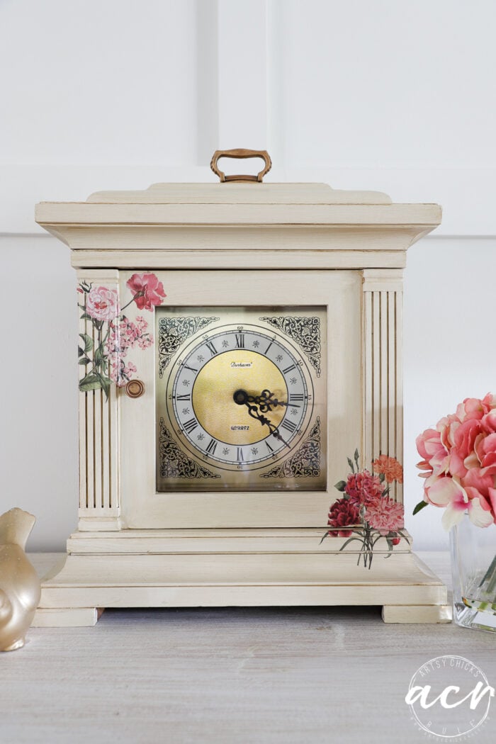 off white antiqued mantel clock with pink and rose colored floral transfers