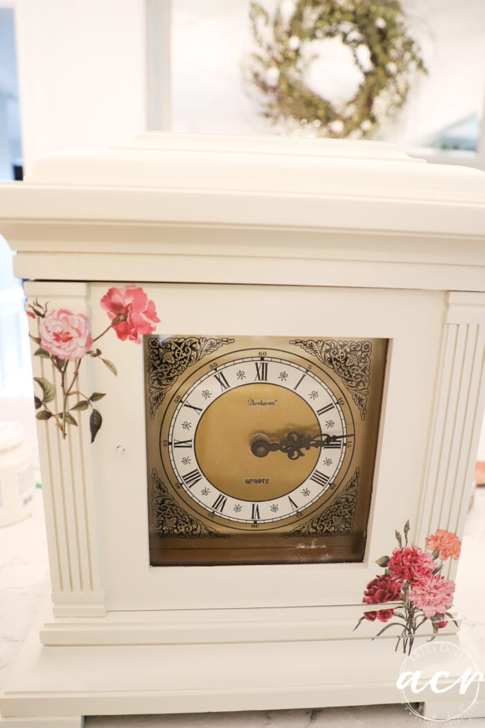 pink and rose colored floral transfers on clock in each corner top and bottom