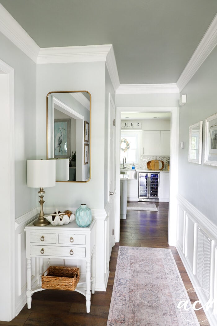 light and bright foyer with white trim and darker ceiling