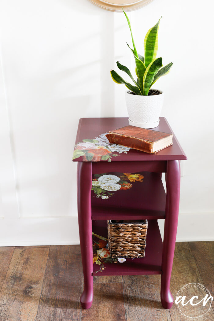 elderberry table with transfers and green plant with book and basket