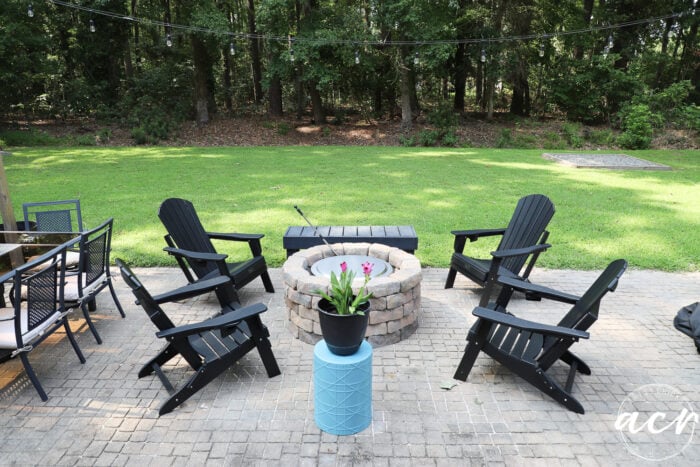 black and tan patio and decor with aqua planter stand