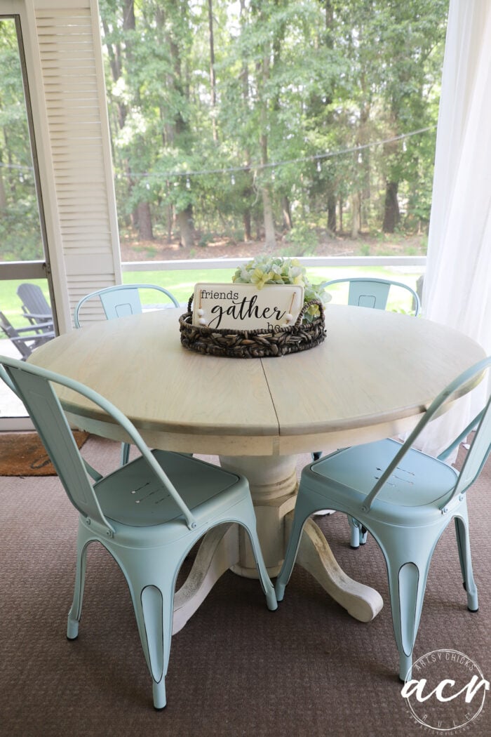 table with aqua chairs brown carpet white sheer curtains 