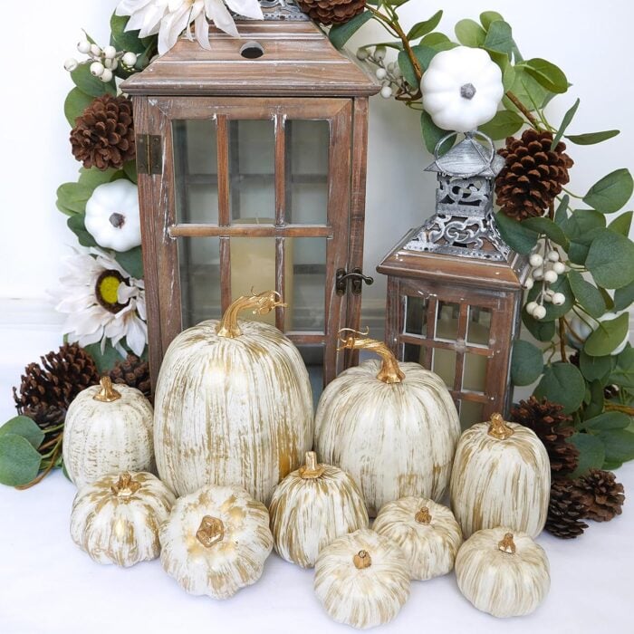 lanterns with gold and white mini pumpkins
