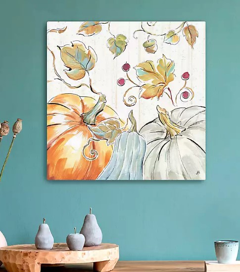 whimsical painting of pumpkins and leaves on wall